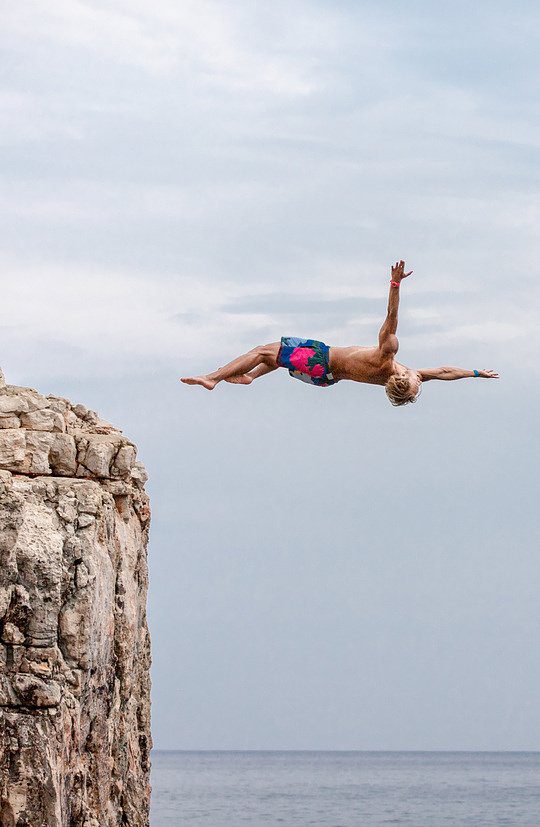 Surf Yoga Beer cliff jumping. Credit: surfyogabeer.com