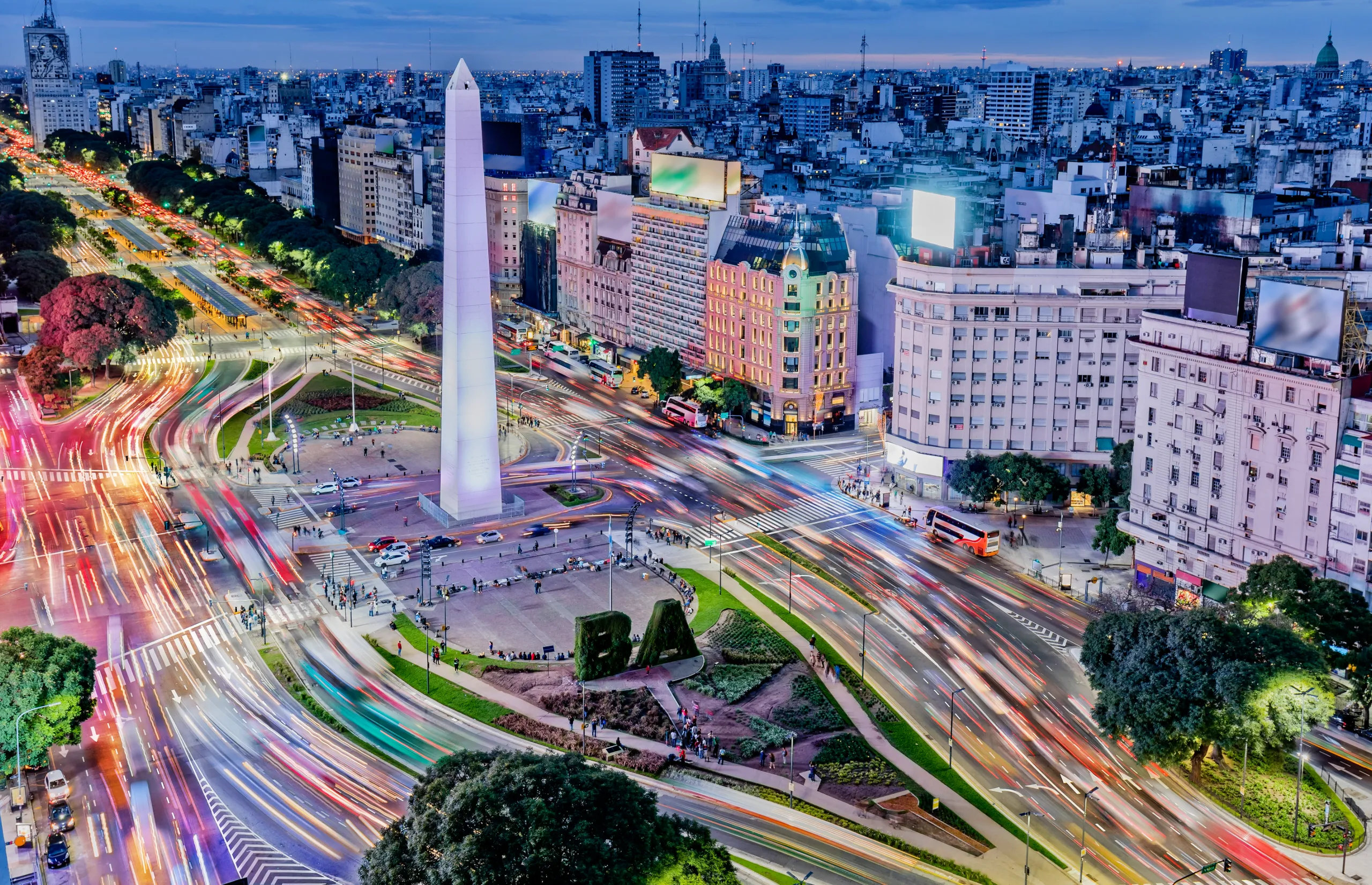 Luxury Travel Summer 2025 issue - Argentina Buenos Aires downtown with traffic cars at night arround the Obelisco