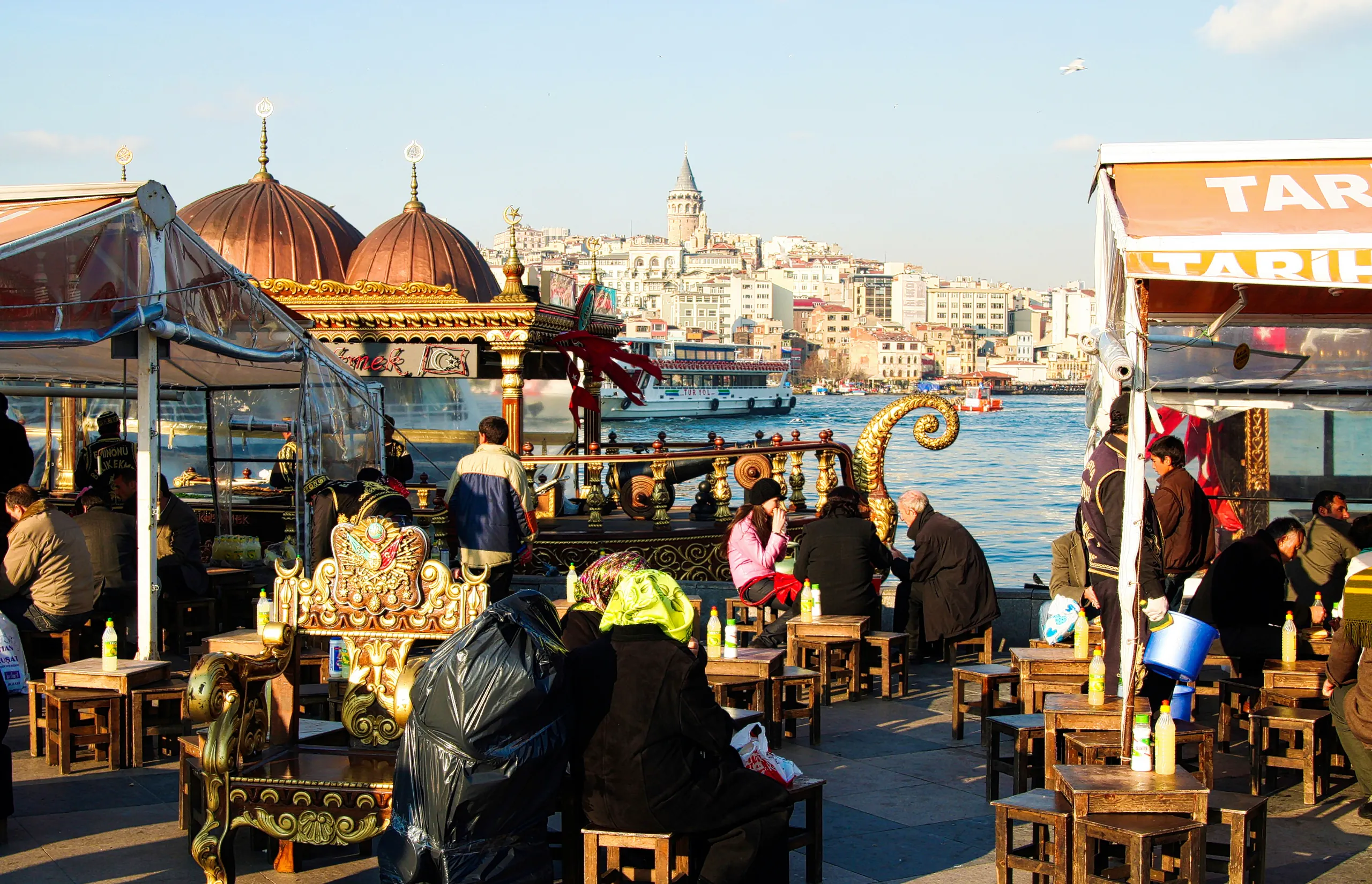 Istanbul, Turkey - FEBRUARY 24. 2009: View from market with chairs and tables over Bosphorus river on asian district