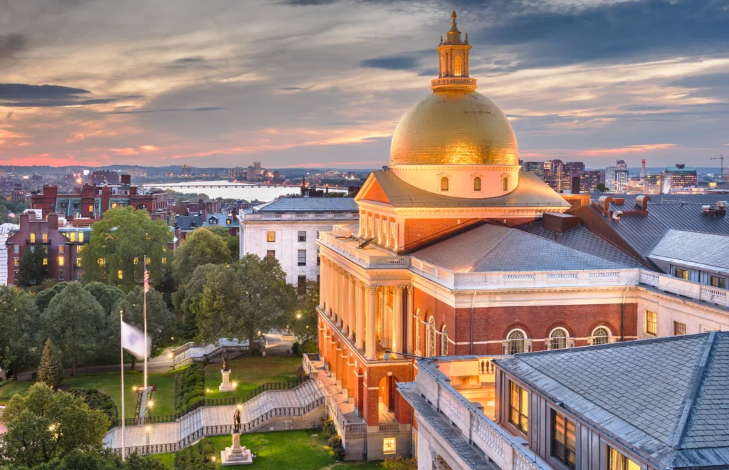 Boston, Massachusetts, USA cityscape with the State House at dusk.