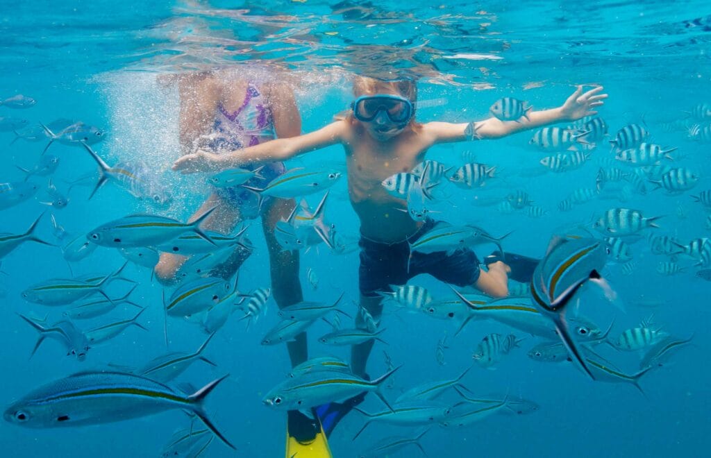Credit: Tourism Fiji - Kids Snorkelling With Fish Landscape