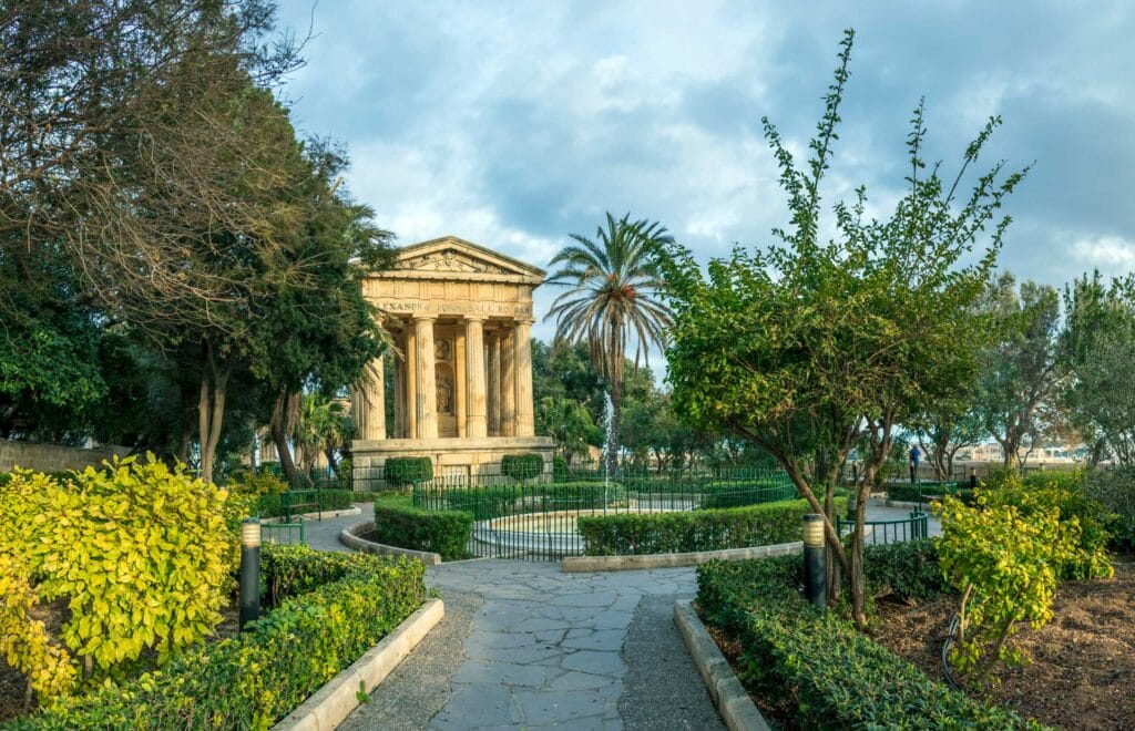 The Lower Barrakka Gardens with palm trees and the monument to Alexander Ball in Valletta, Malta