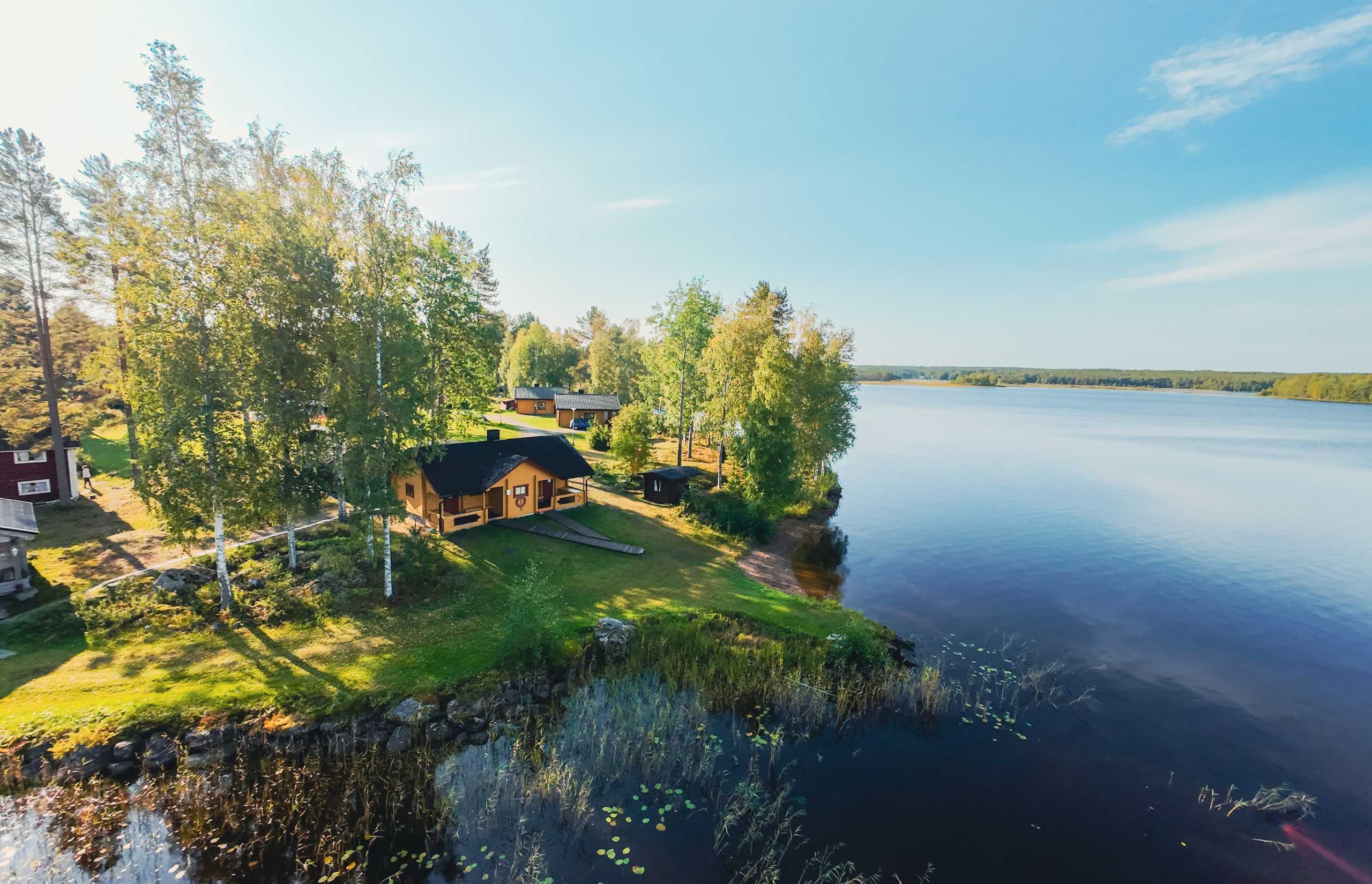 Traditional Log House by a Finnish Lake