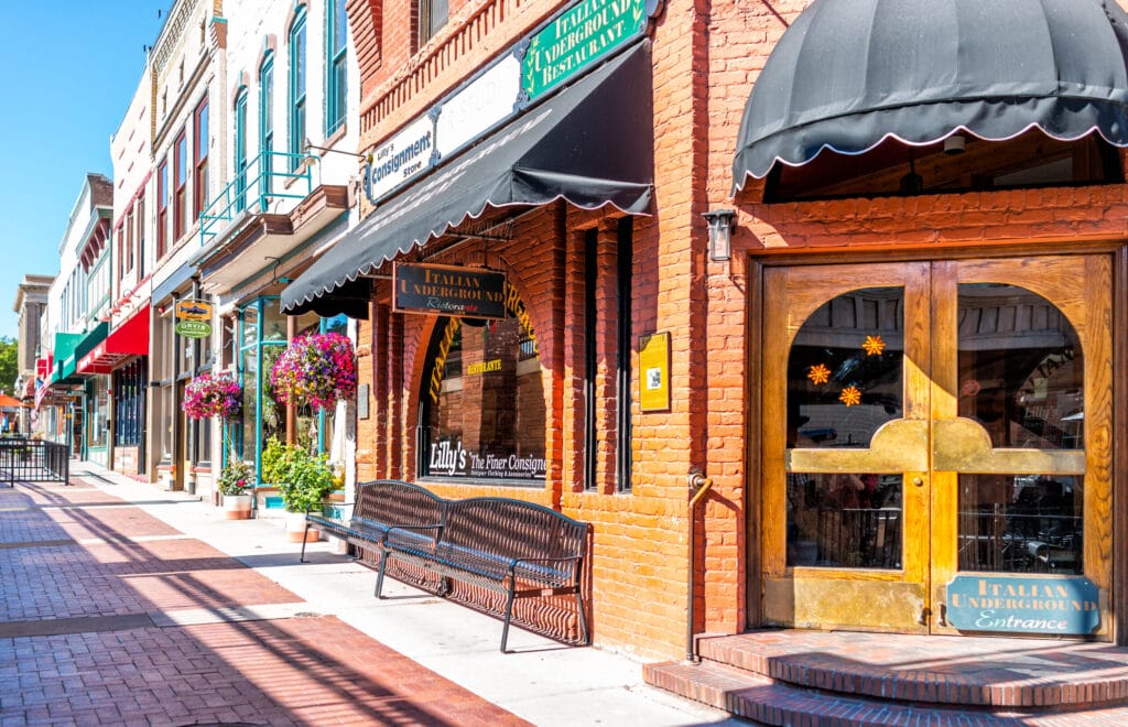 Historic street sidewalk in Colorado on Grand Avenue and Italian restaurant