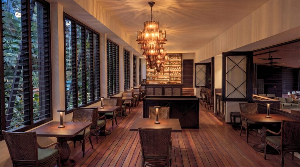 The Long Room at Ever Bloomfield lit by chandelier at evening, Daintree Coast Queensland