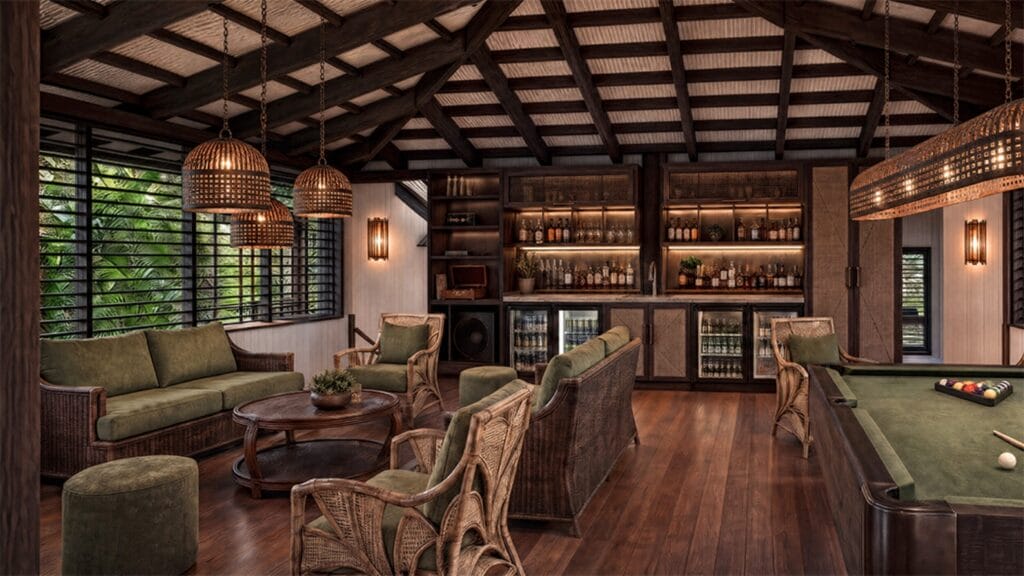 The Speak Easy bar at Ever Bloomfield with rattan furniture, pool table and backlit spirits shelf