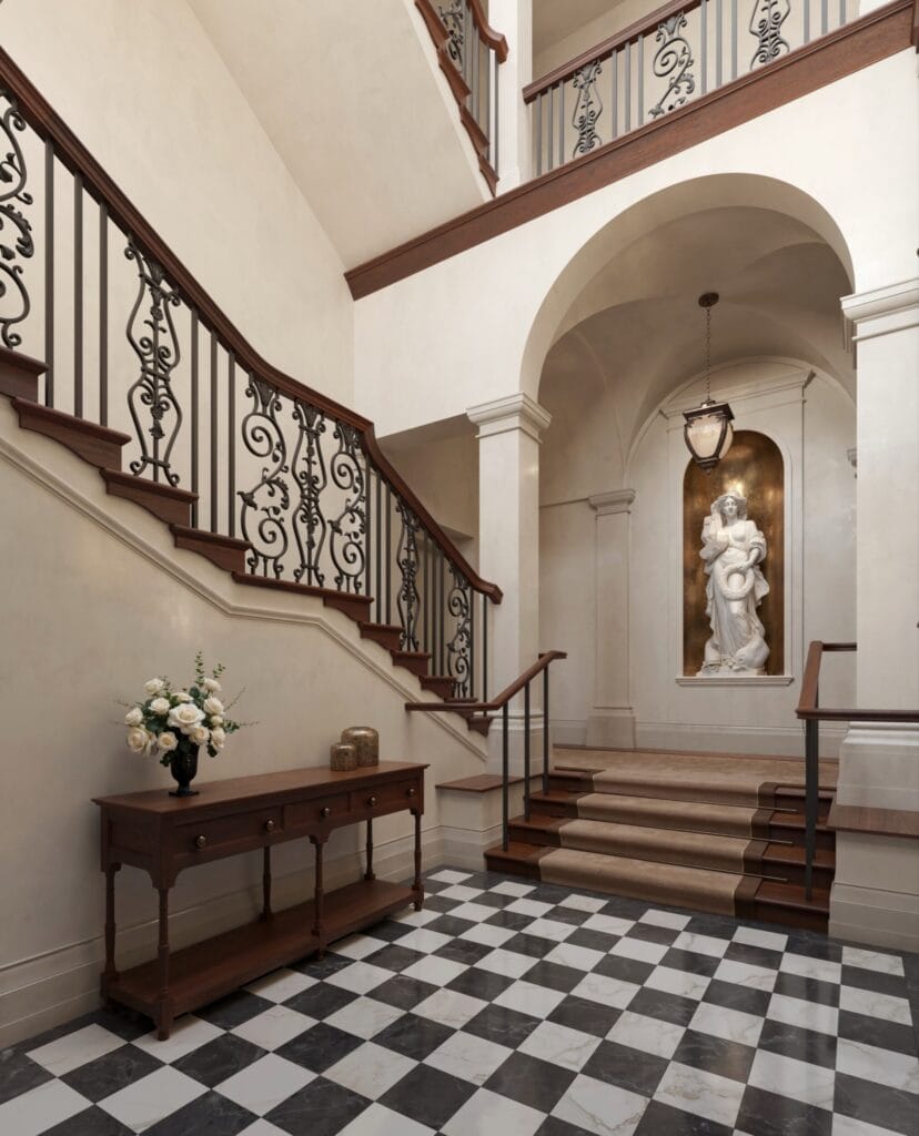 The entrance to the North Wing residential suites at Waldorf Astoria London Admiralty Arch, with checkered marble floors and wrought-iron staircase