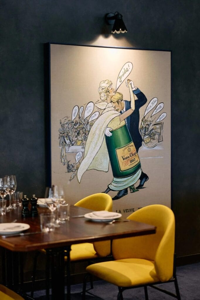 Pompette Champagne Bar + Restaurant in Brisbane, featuring a large framed vintage-style print of a woman dancing with a Veuve Clicquot bottle