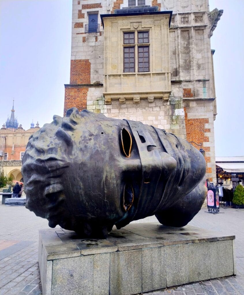 Eros Bendato by Igor Mitoraj, gifted to Kraków in 2003, stands in the Main Market Square