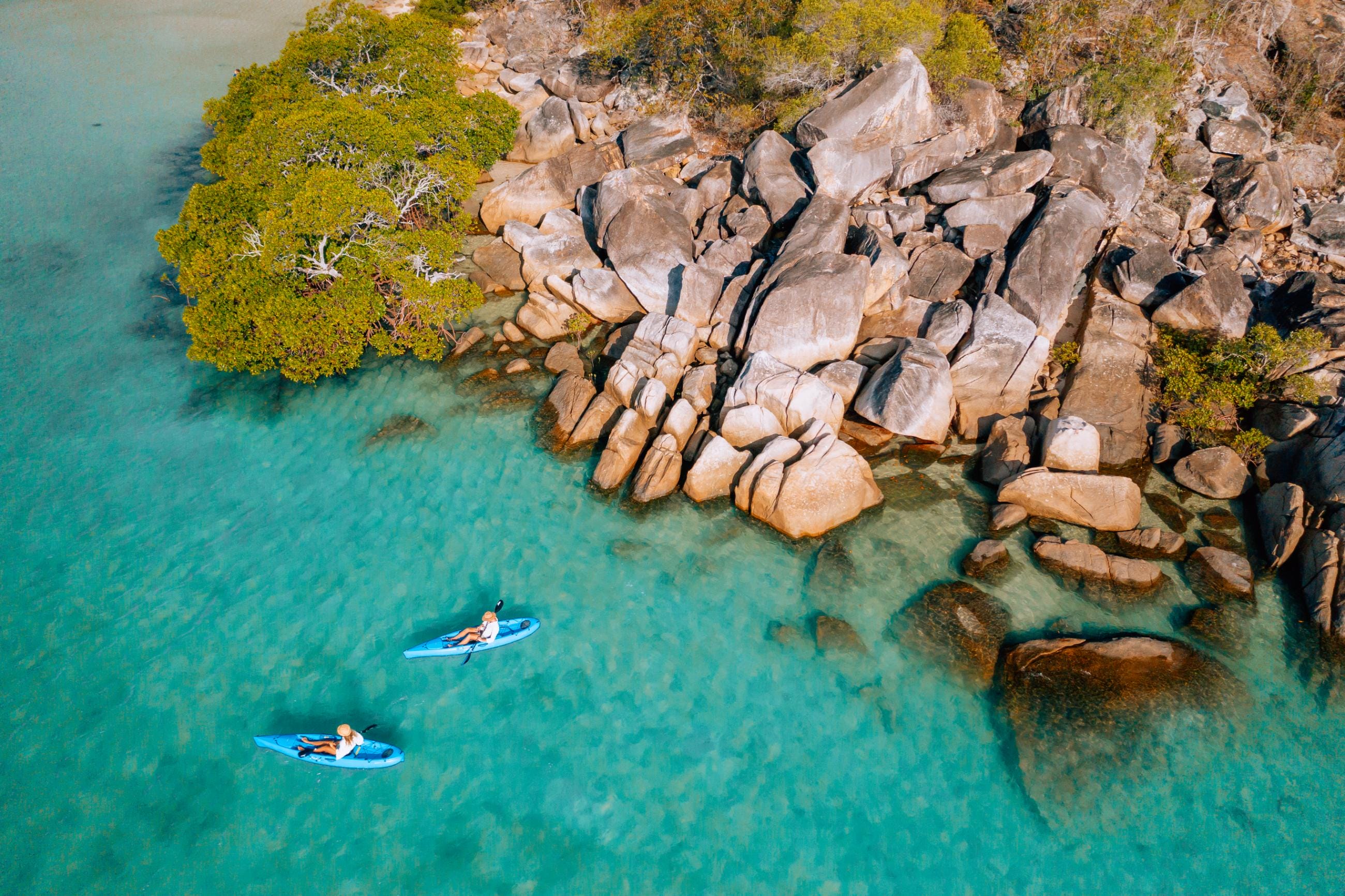 Kayaking in the clear turquoise waters off the coast of Orpheus Island Lodge. Image credit: James Vodicka