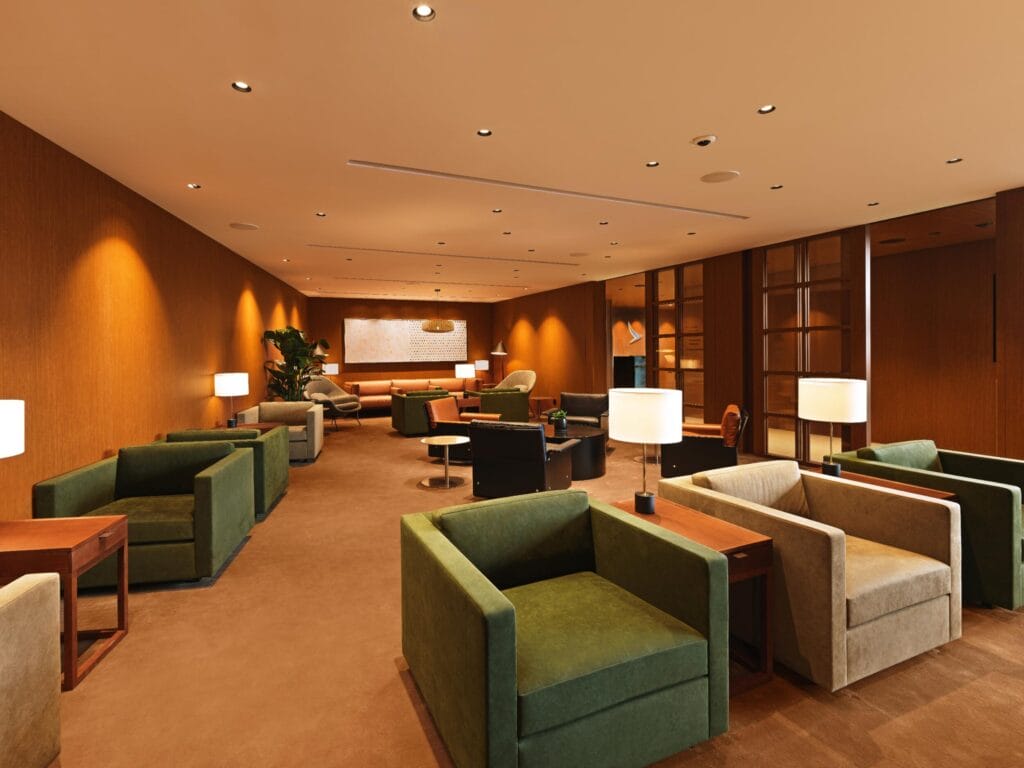 Renovated Cathay Pacific lounge at Beijing Capital Airport, defined by its signature ceiling and warm wood paneling