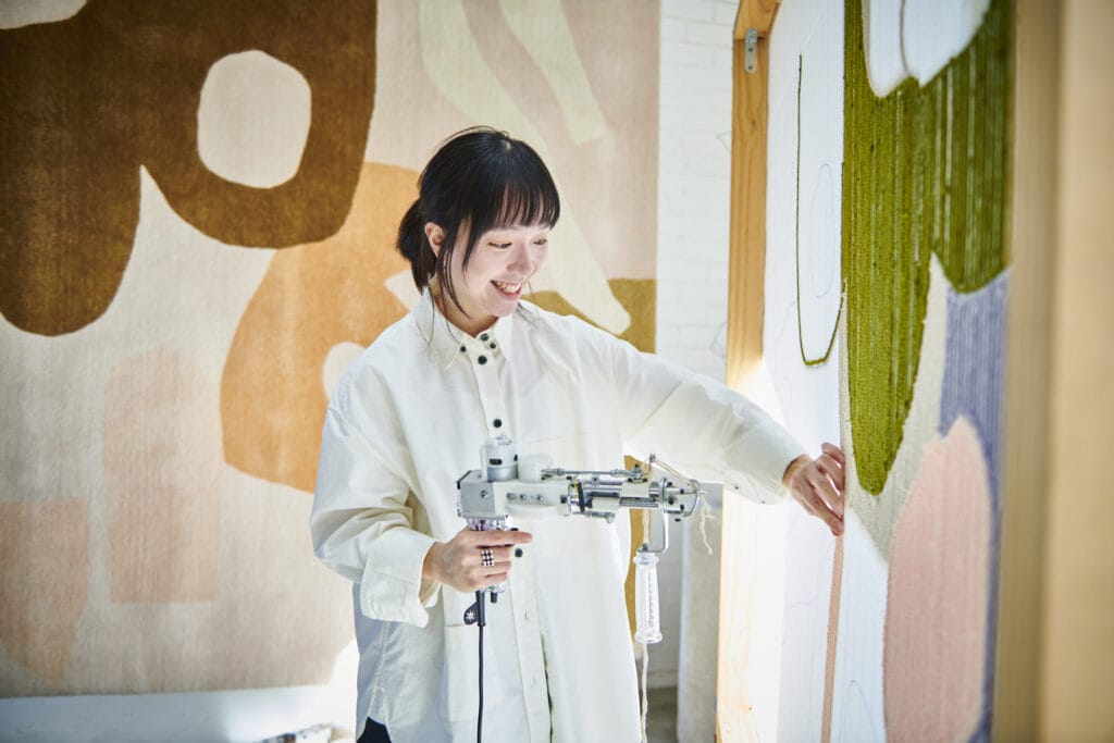 A designer demonstrating rug tufting at Saturday Indesign Sydney 2026