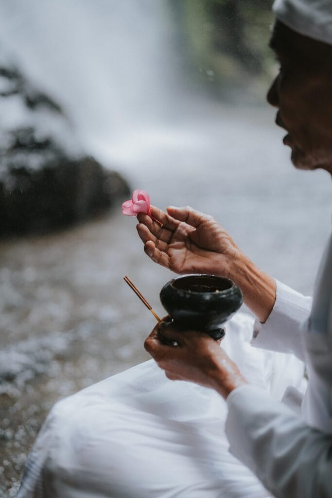 Balinese cleansing ceremony (melukat) or spiritual offering practice meant for renewal and inner balance.