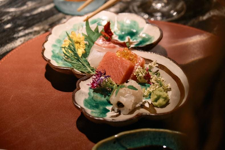 a delicate assortment of fresh sashimi and appetizer bites