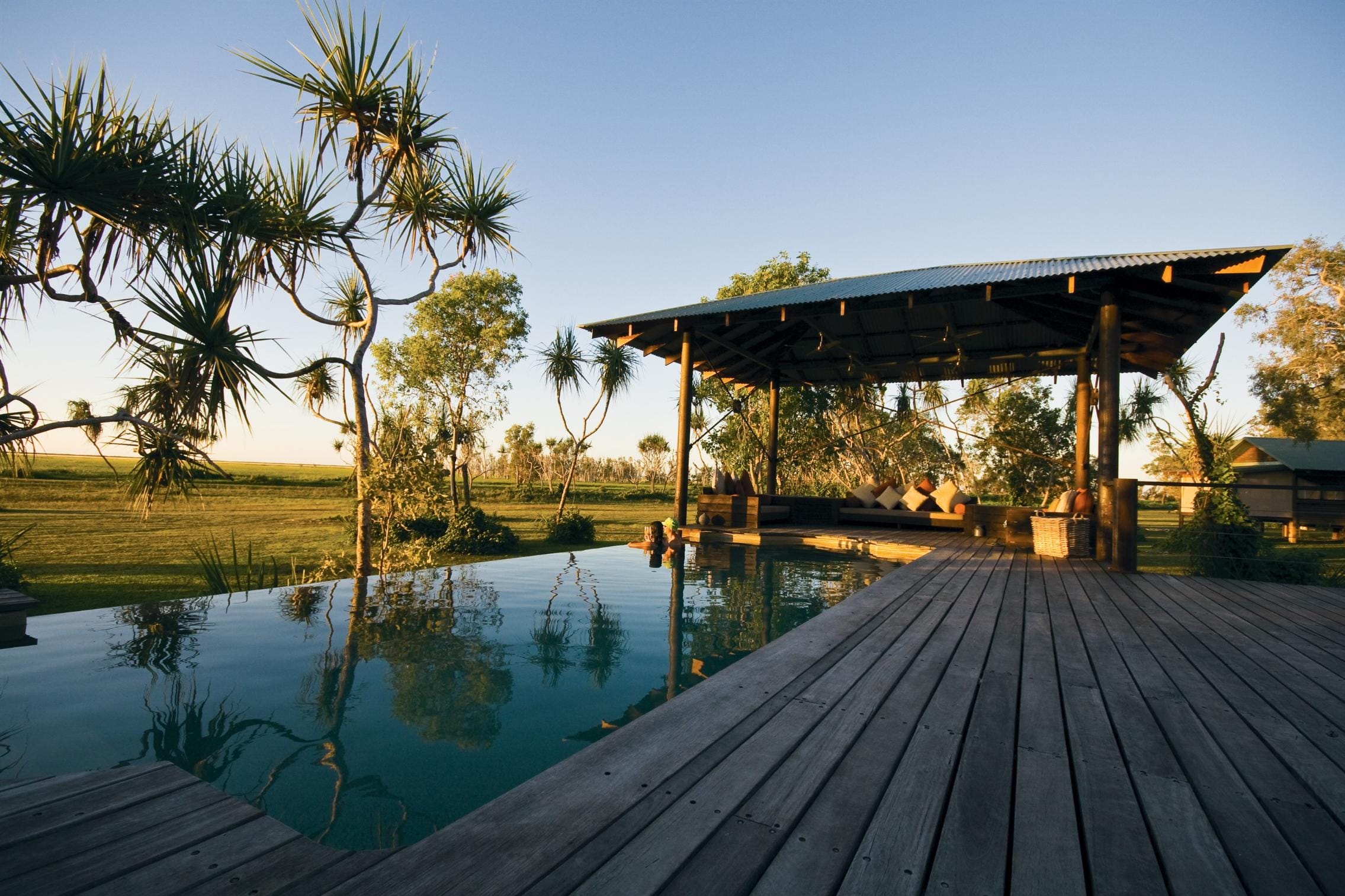 pool deck and infinity-edge swimming pool at Bamurru Plains