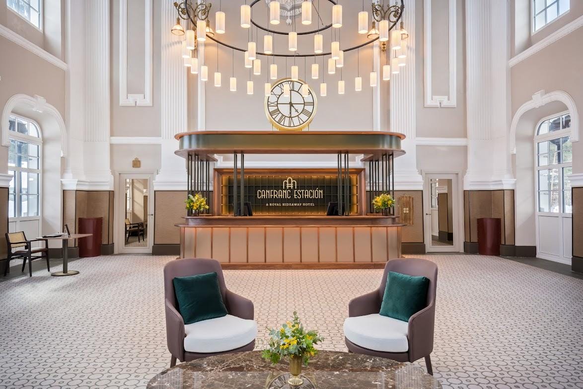 grand lobby and reception desk of the Canfranc Estación, a Royal Hideaway Hotel