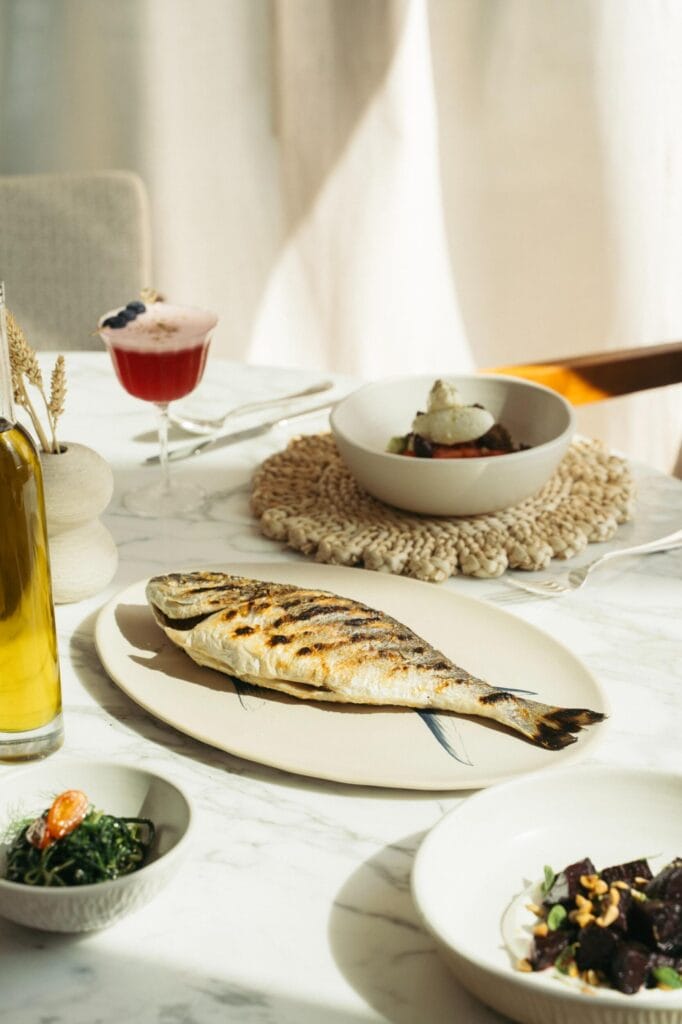 Baked whole fish paired with Mediterranean classics at Jumeirah Marsa Al Arab