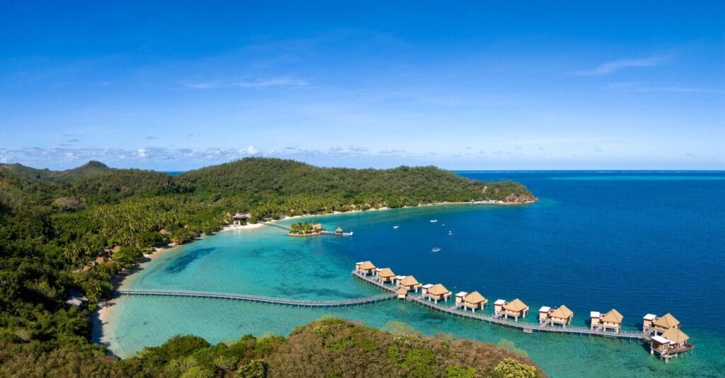 Likuliku Lagoon Resort featuring its signature overwater bures