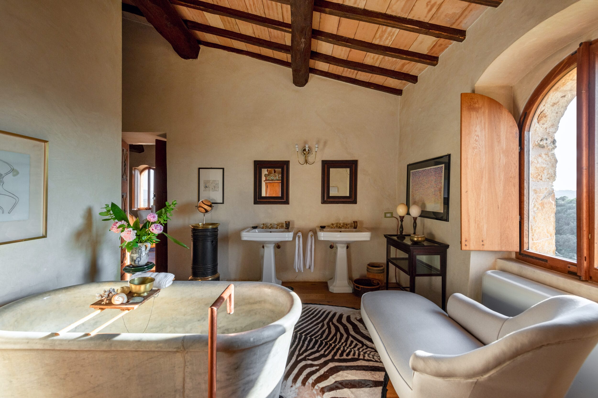Rustic luxury bathroom at Castello di Vicarello castle hotel. Image credit: Matteo Serpi