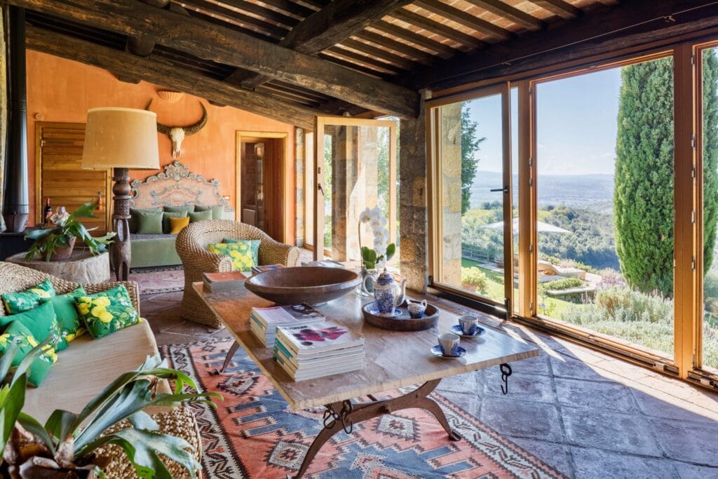 Sunlit rustic living room at Castello di Vicarello. Image credit: Valentina Sommariva