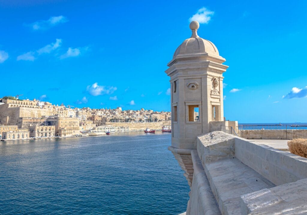 the historic Gardjola, a stone watchtower in the Gardjola Gardens of Senglea, Malta, overlooking the Grand Harbour toward Valletta
