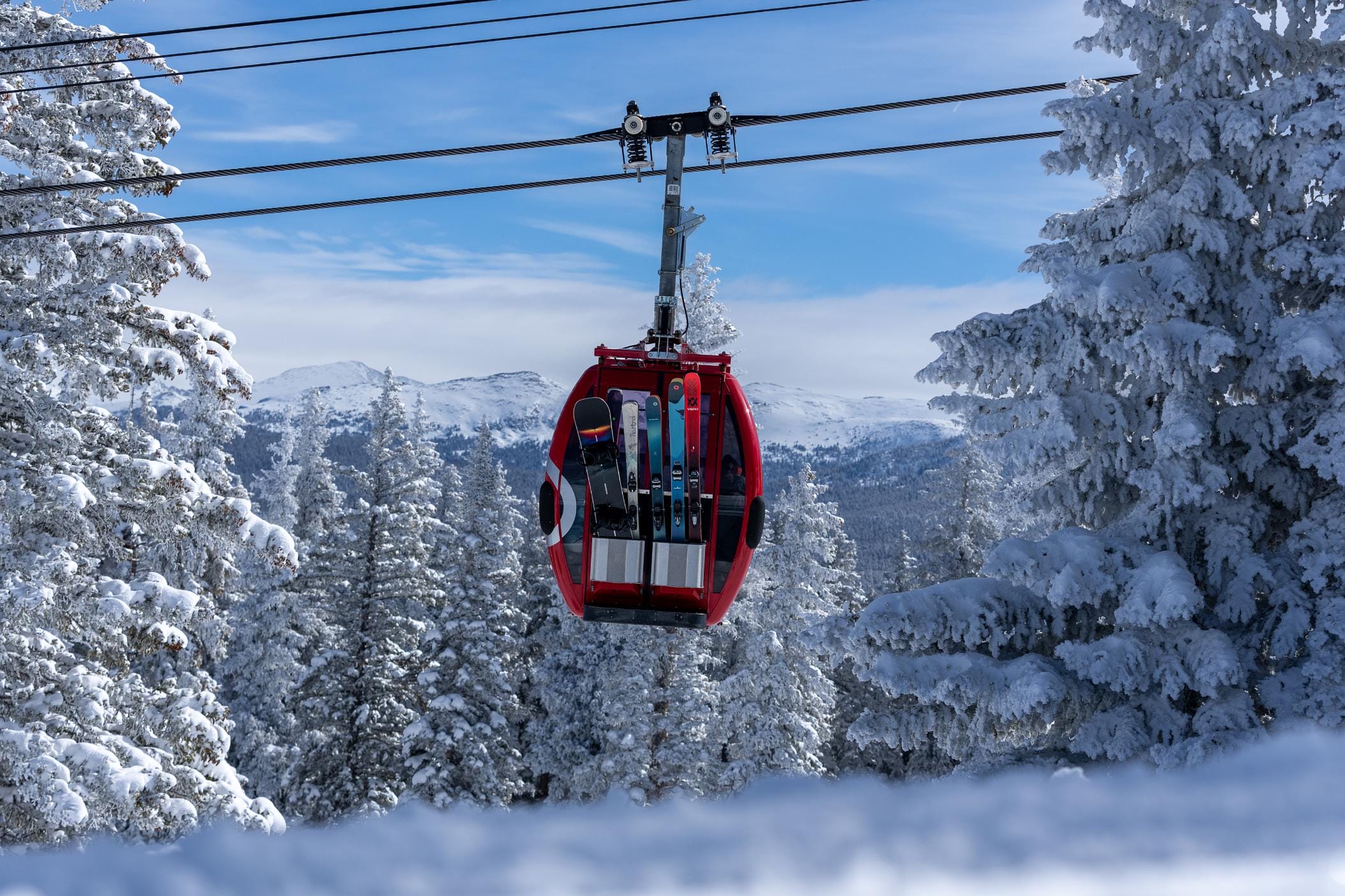 Silver Queen Gondola cabin carrying skis and snowboards on Aspen Mountain in Colorado