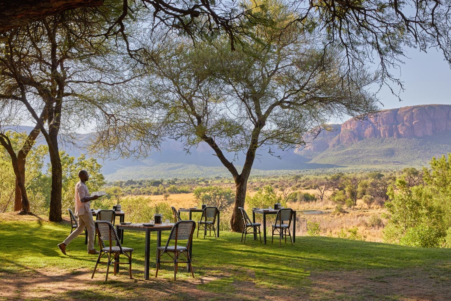 An outdoor dining setup on the lawn at Marataba Safari Lodge