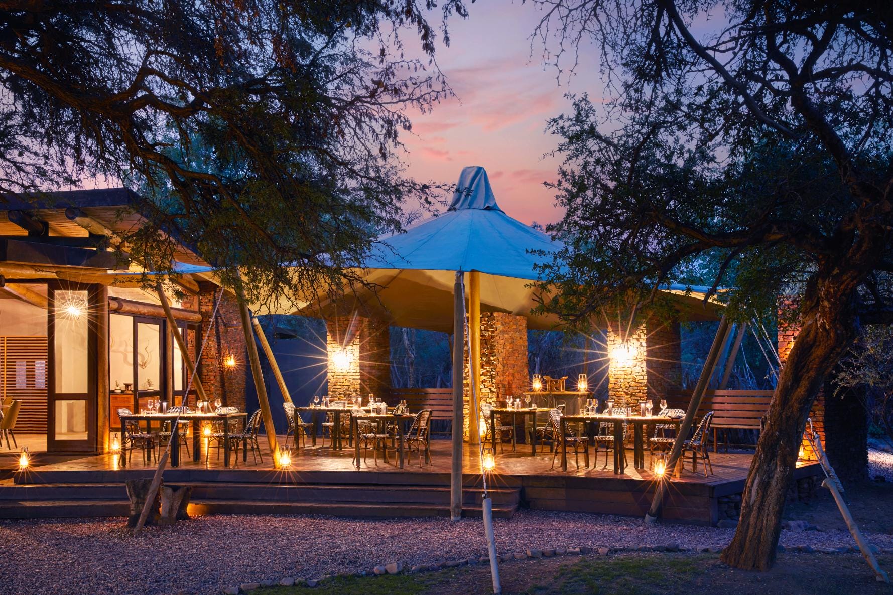 Outdoor dining area and tented deck at Marataba Safari Lodge
